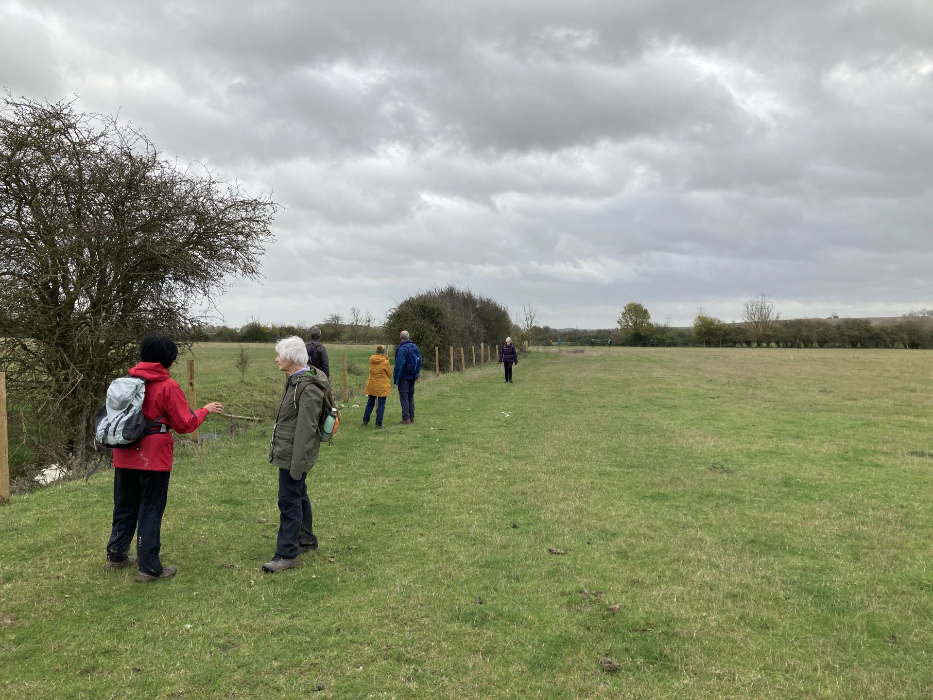 A group of Ramblers en route via fields surrounding Catworth